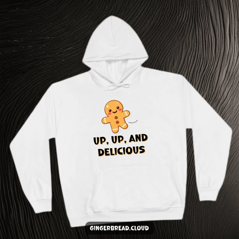 Funny hoodie with a smiling gingerbread cookie gracefully floating upwards on a gentle wind, invoking feelings of freedom and joy.