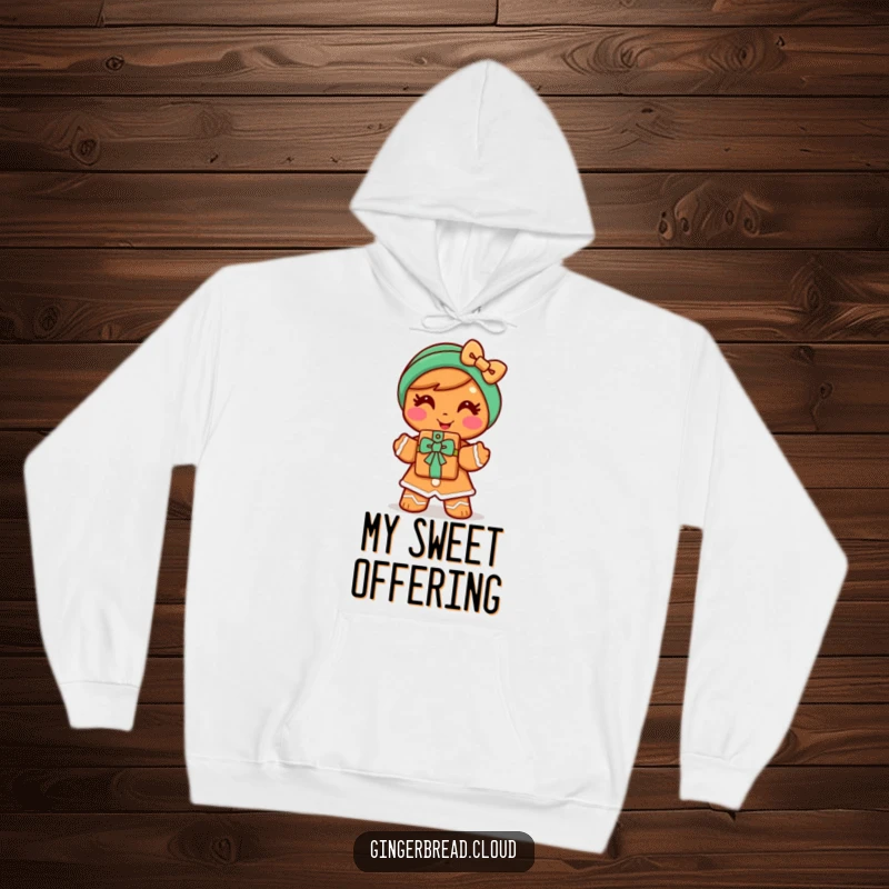 Funny gingerbread woman hoodie showing a cheerful character offering a cookie gift with a warm smile, providing cozy and sweet comfort.
