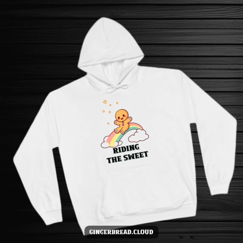 Funny gingerbread man hoodie showing a gingerbread cookie character gleefully sliding down a vibrant rainbow, designed for cozy fun.