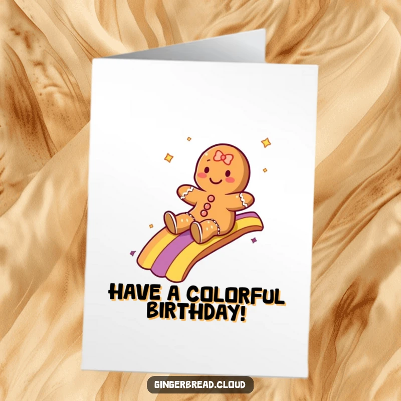 Funny Free Printable Birthday Card: A gingerbread character joyfully sliding down a vibrant rainbow, spreading birthday cheer.