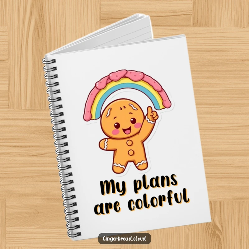 Excited gingerbread character pointing at a vibrant icing rainbow, on a notebook cover for joyful writing and planning.